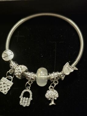 Silver Charm Bracelet with White Opalescent Bead and Hanging Charms